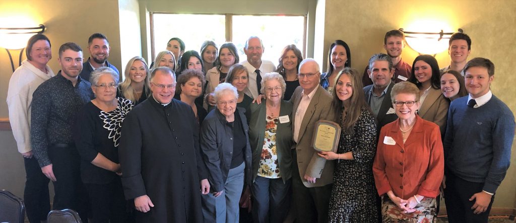 Fr. Altier, Colleen Perfect, Art Herkenhoff family members with Andrea Kullmann and her husband, Todd